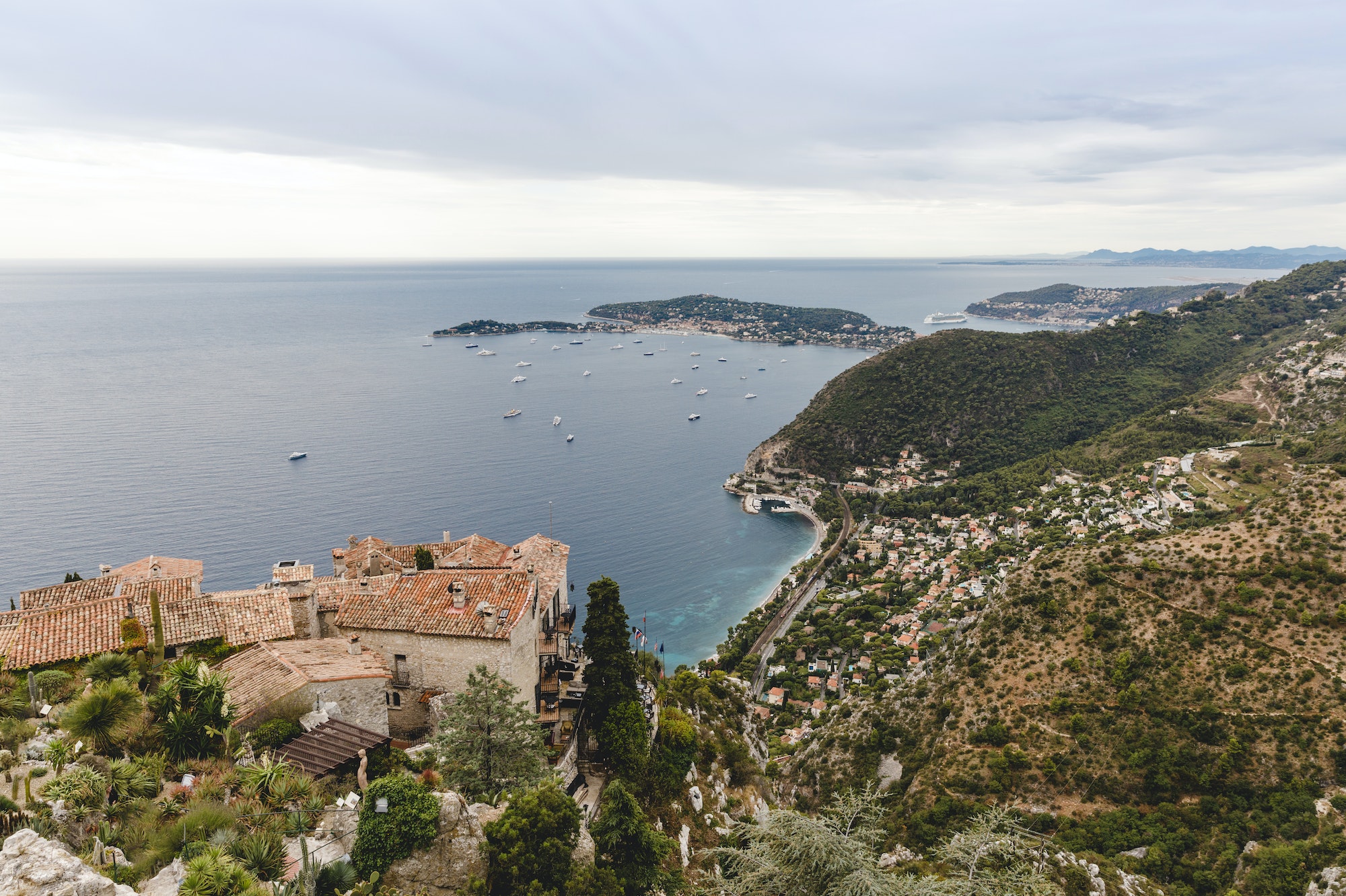aerial view of city located on hills by seashore on cloudy day, Eze, France